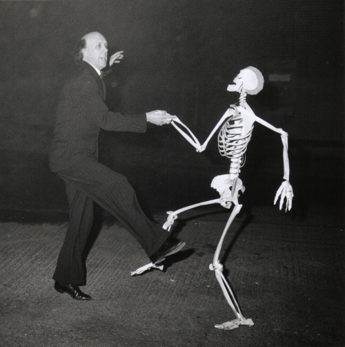 Judge dancing with skeleton